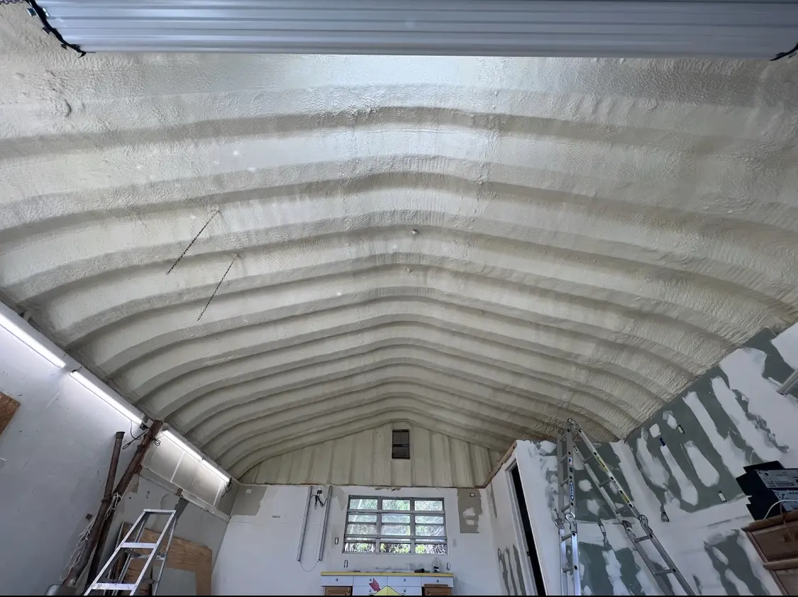 Spray polyurethane foam applied to the underside of a metal roof deck in Vero Beach